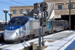 Westbound Acela Express comes though the station